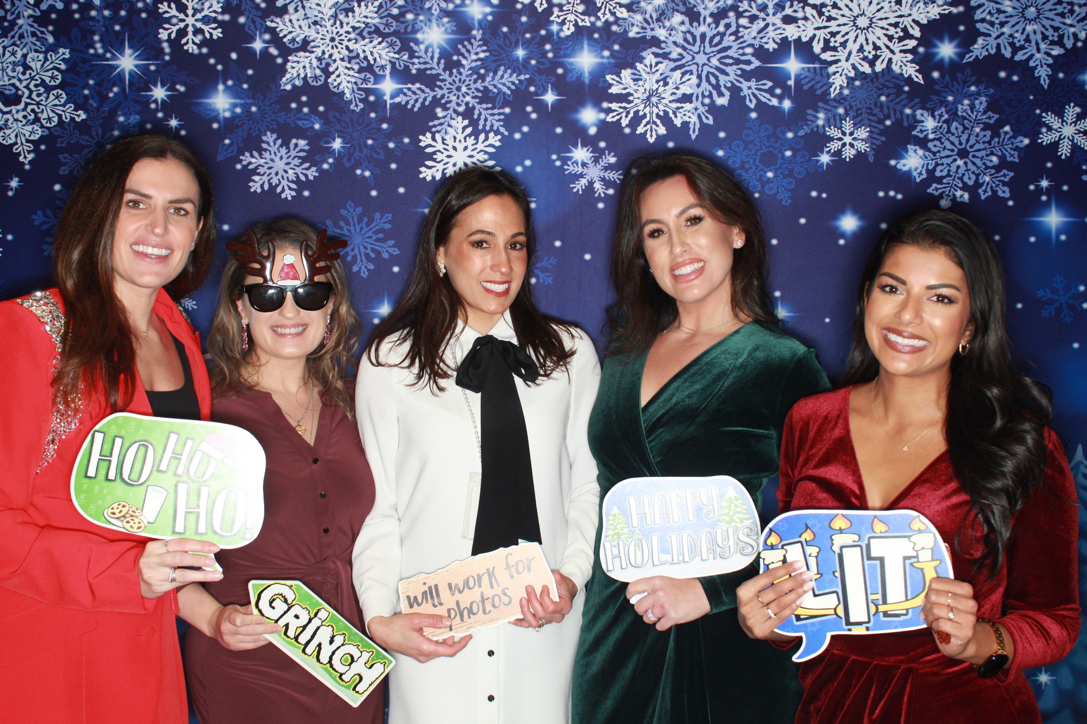 FOX team enjoying their company holiday photo booth
