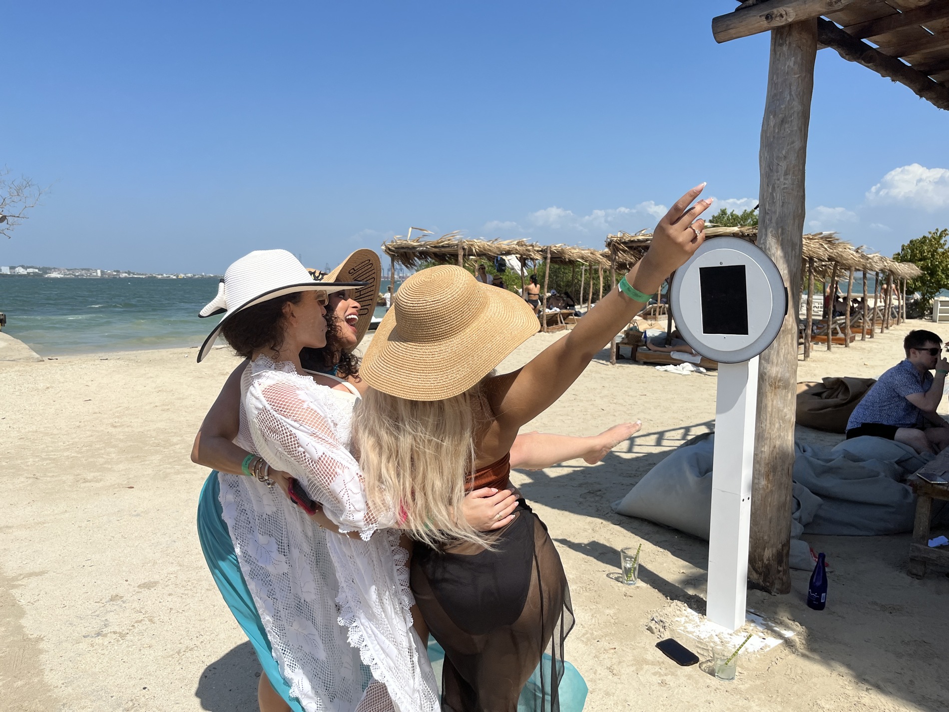 Guests gathering at the real self-service selfie booth beside the beach