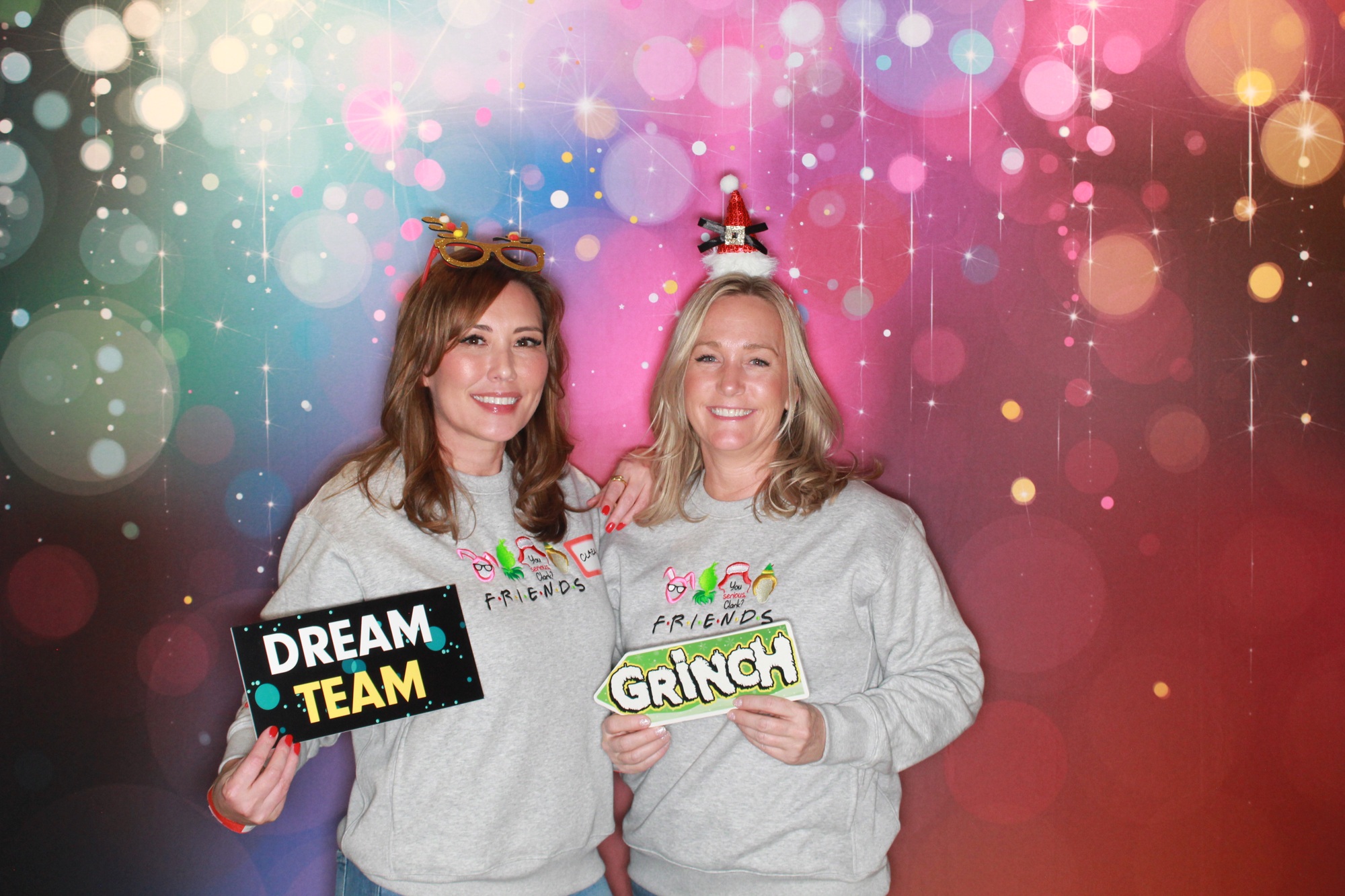 DRT holiday-party guests posing with playful props
